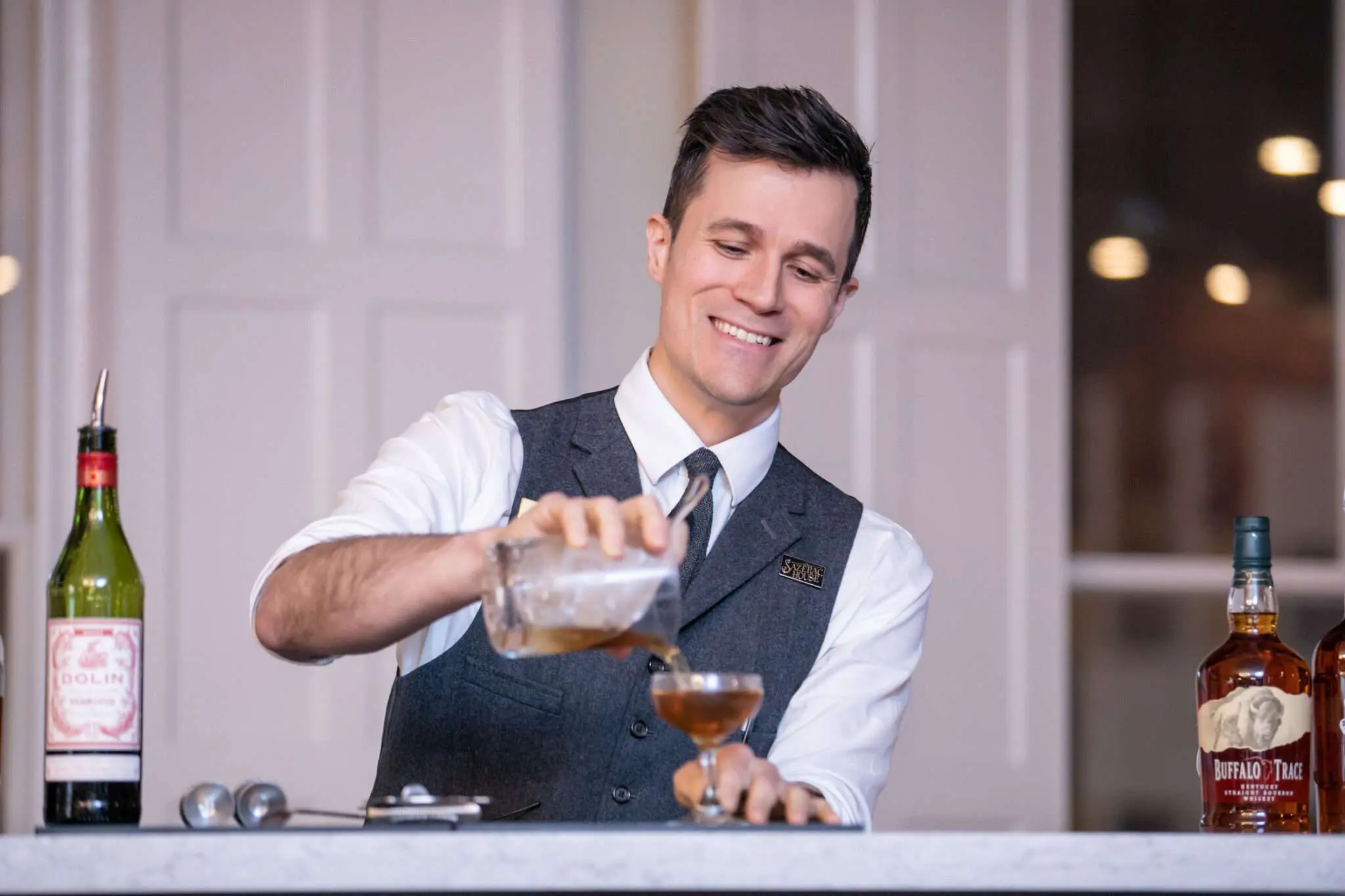 Bar boy making drink