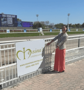 messina's sign at fair grounds race course louisiana derby day