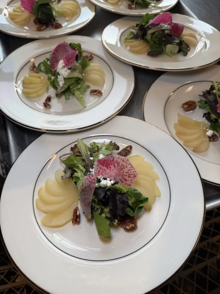 nace legacy dinner at the rooftop on basin salad with poached pears