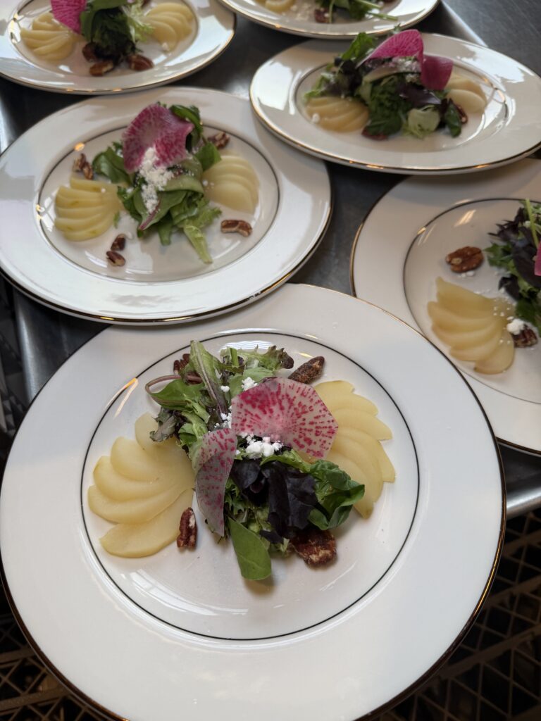 nace legacy dinner at the rooftop on basin salad with poached pears